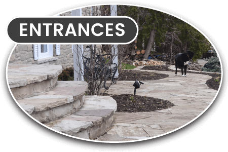 Home entrance with stone landscaping